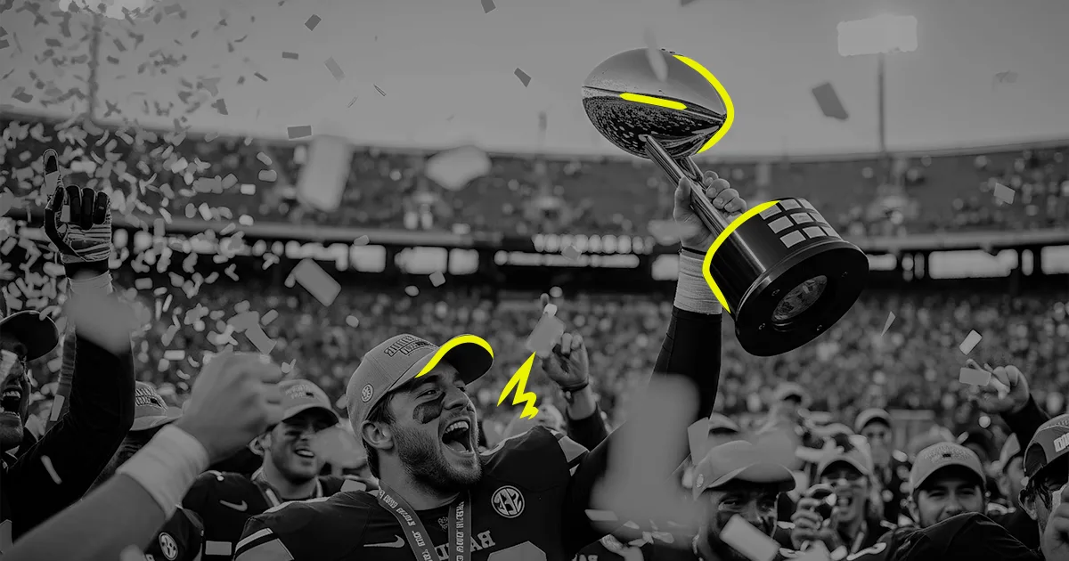 Football player celebrating with a championship trophy in a packed stadium during the Super Bowl