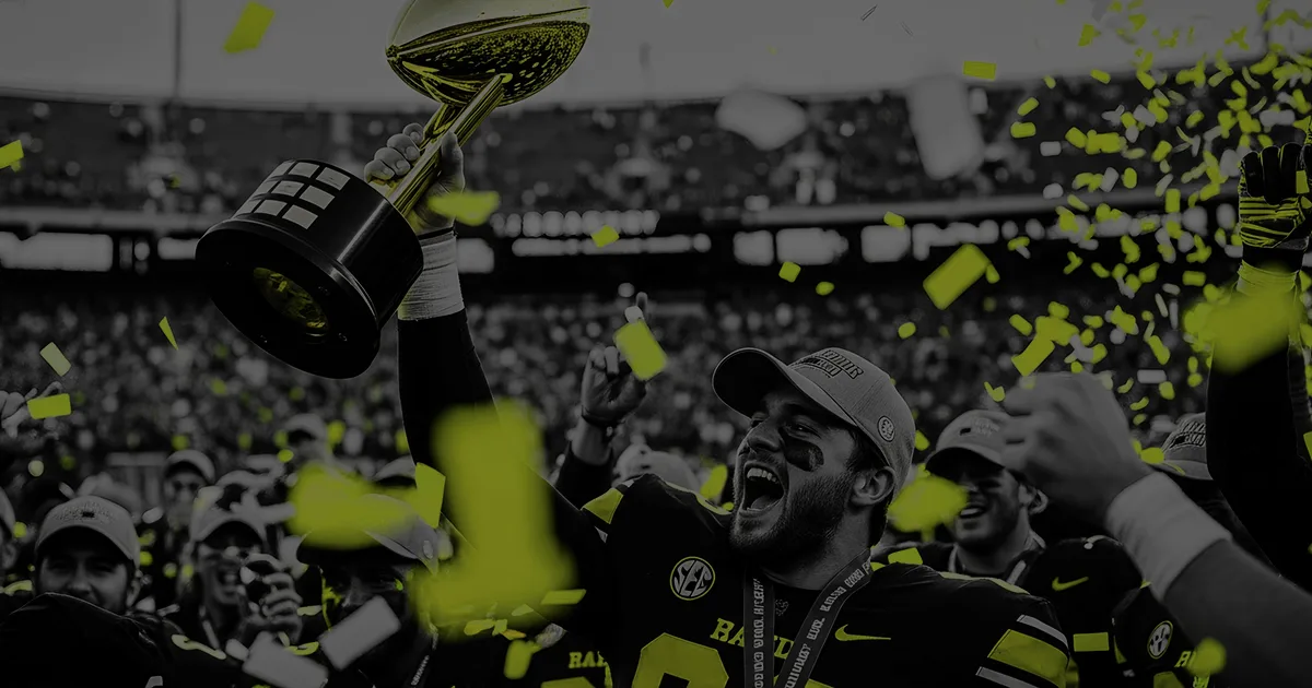 Black and neon color photo of a super bowl player holding up a trophey