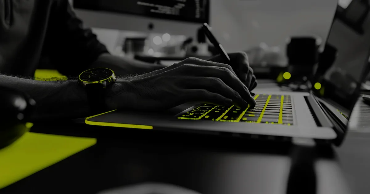 stylized image of someone typing on a laptop keyboard