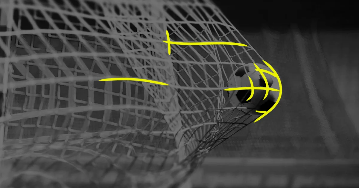 Black and white image of a football in the back of the goal net