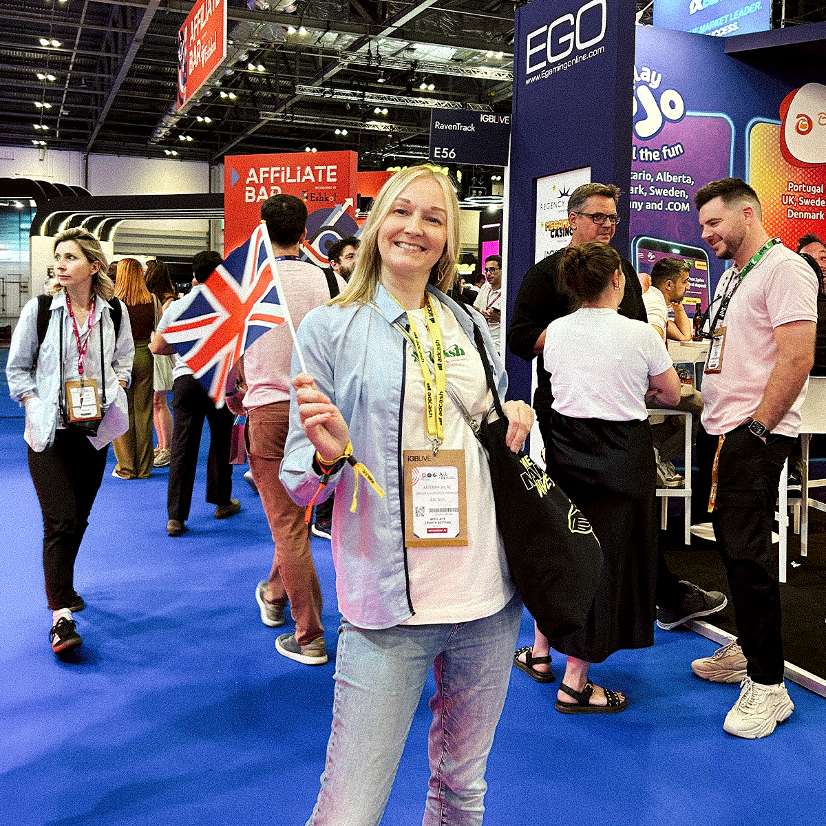 Katerina at iGB Live London waving a GB flag