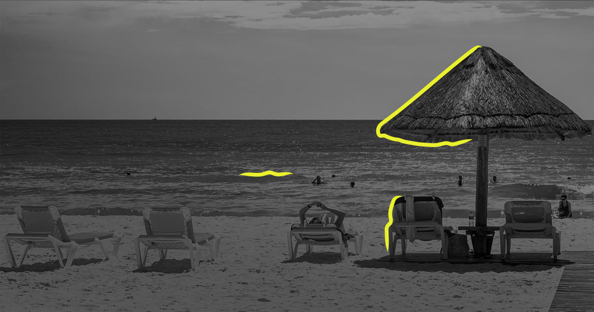 Black and white lanscape of an umbrella on Cancun beach
