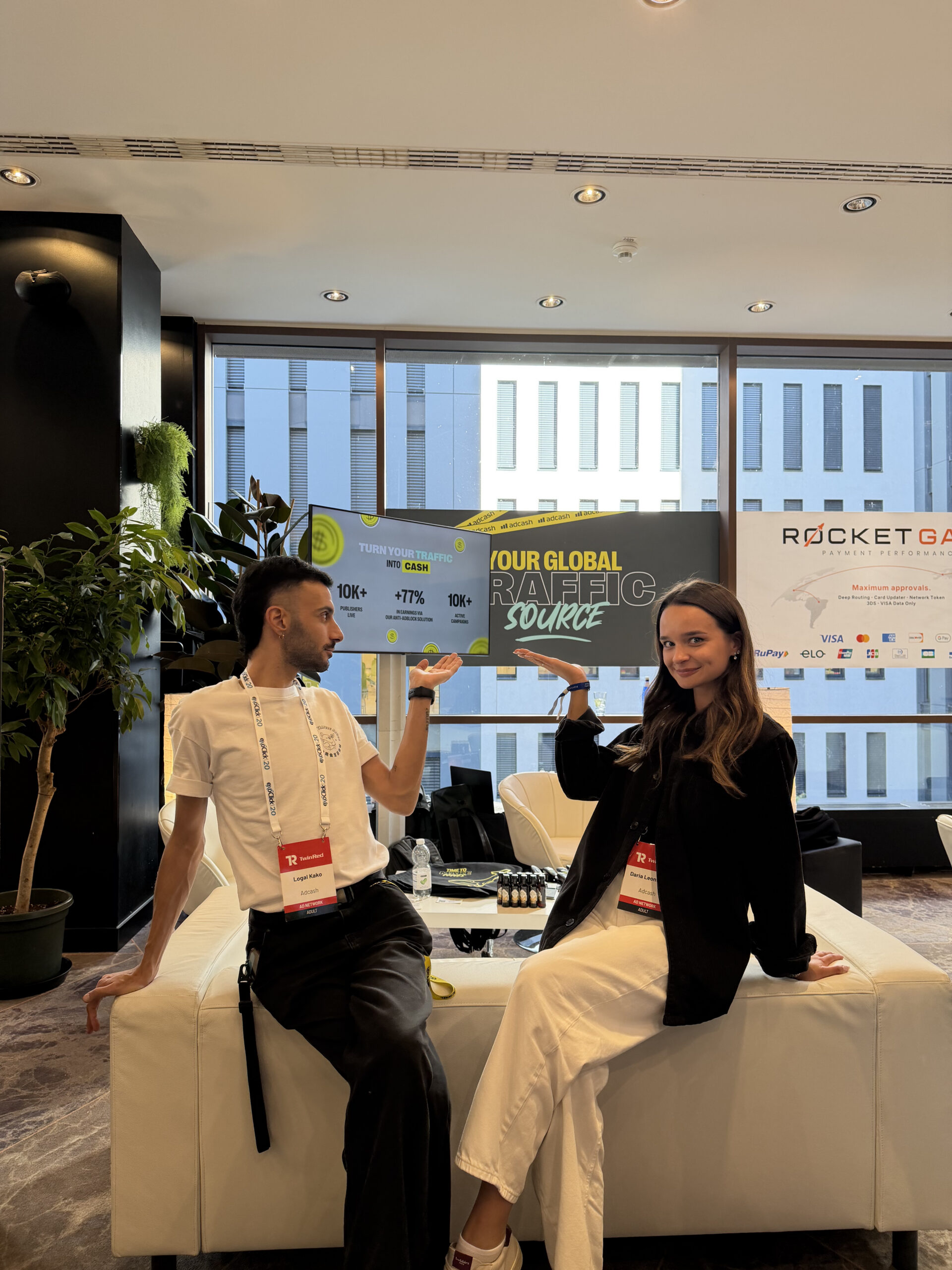 Adcash employees showing off their visuals and branding at TES Prague